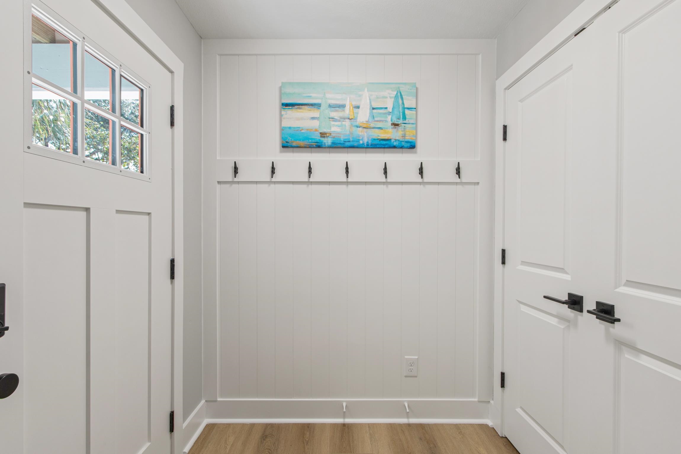 112 2nd Street St. Augustine, FL 32080 - Photo 6 of 49 a view of a hallway with paintings on the wall