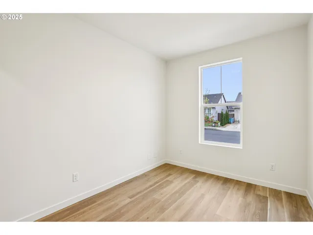 a kitchen with granite countertop a refrigerator stove top oven and sink