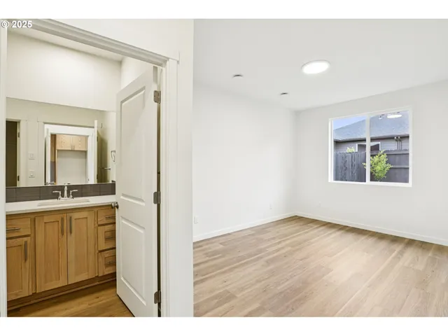 a view of a kitchen cabinets and wooden floor