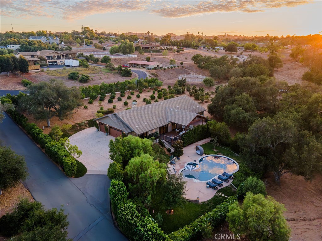 an aerial view of a house with a garden