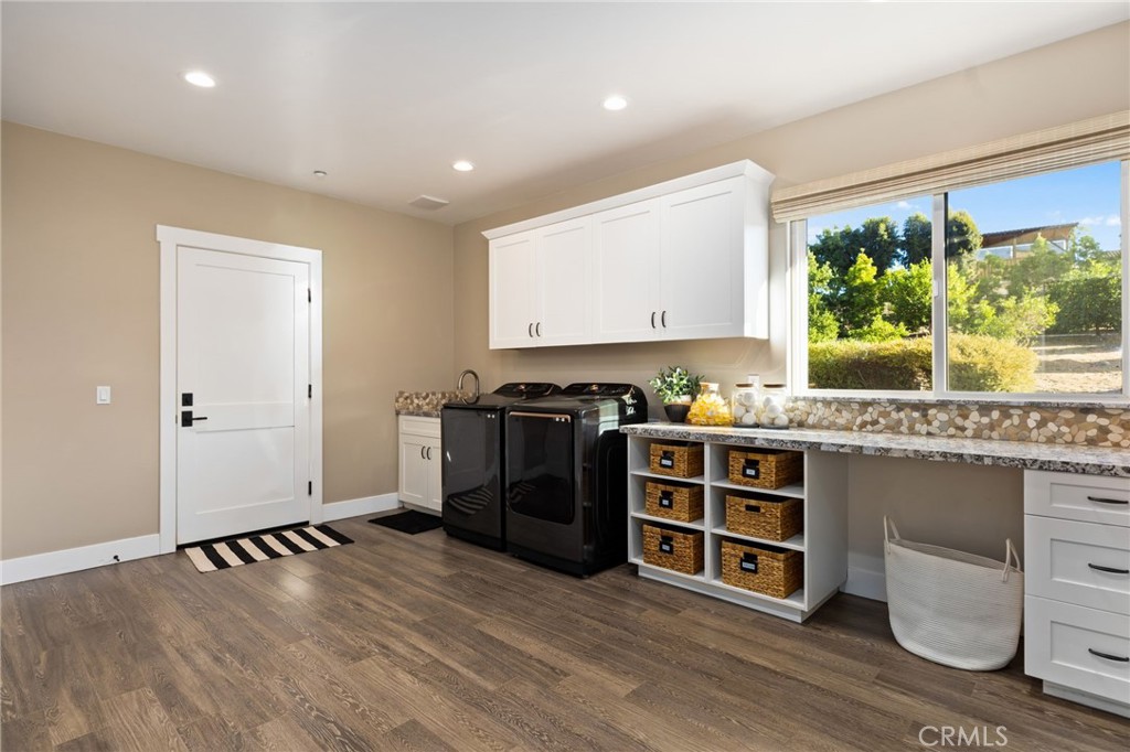 4007 Ladera Vista Road Fallbrook, CA 92028 - Photo 24 of 64 a view of kitchen with stainless steel appliances granite countertop a stove and a wooden floors