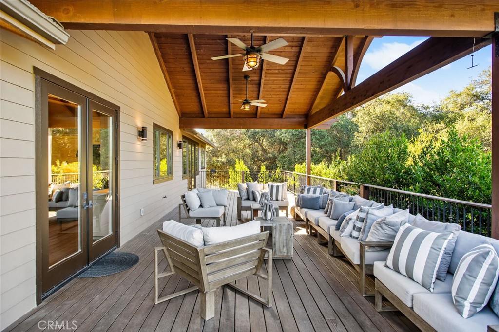 4007 Ladera Vista Road Fallbrook, CA 92028 - Photo 30 of 64 a balcony with furniture and wooden floor
