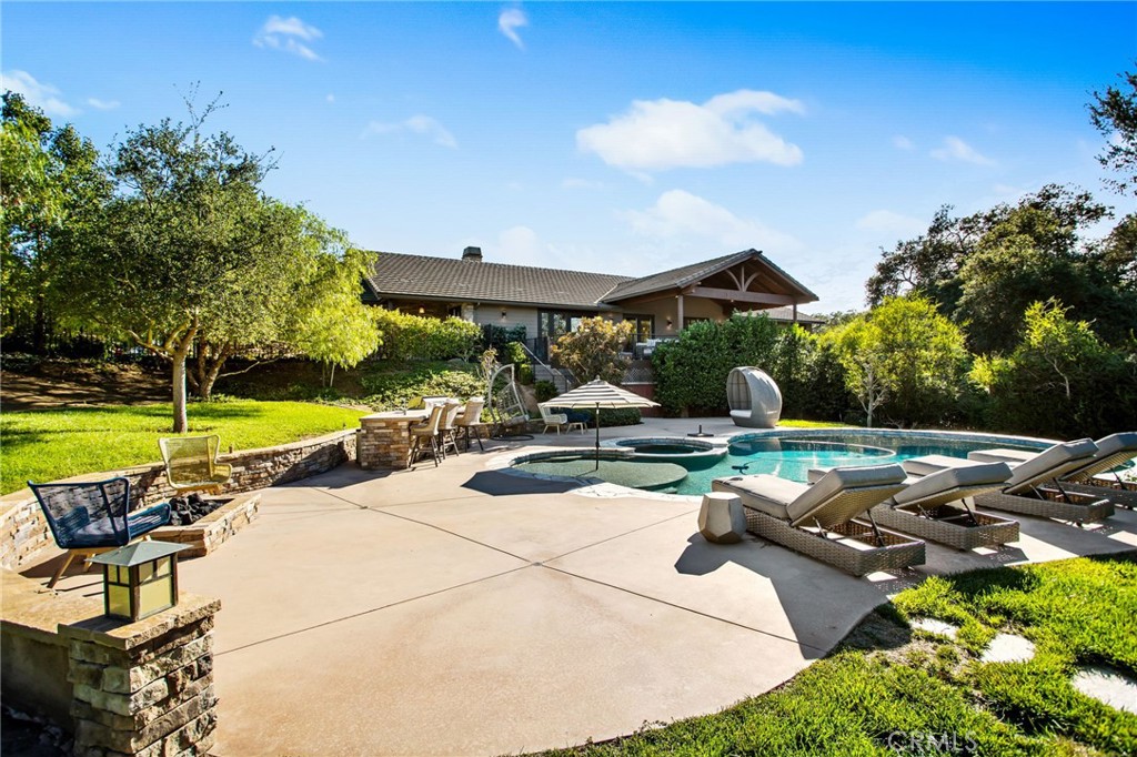 4007 Ladera Vista Road Fallbrook, CA 92028 - Photo 43 of 64 a view of a swimming pool and lounge chairs