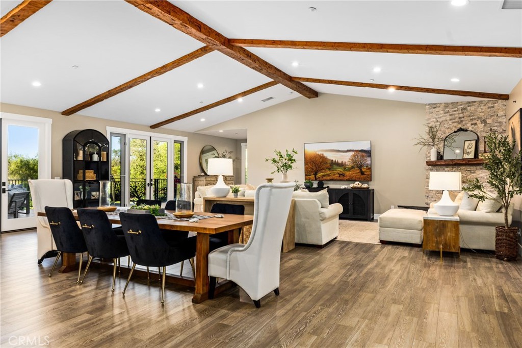 4007 Ladera Vista Road Fallbrook, CA 92028 - Photo 8 of 64 a view of a dining room with furniture and wooden floor