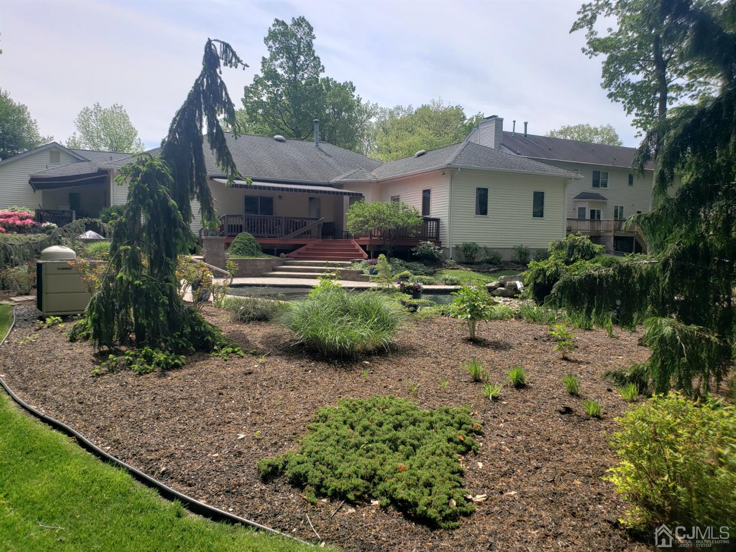 41 Dundee Road Kendall Park, NJ 08824 - Photo 13 of 42 a front view of house with yard and outdoor seating