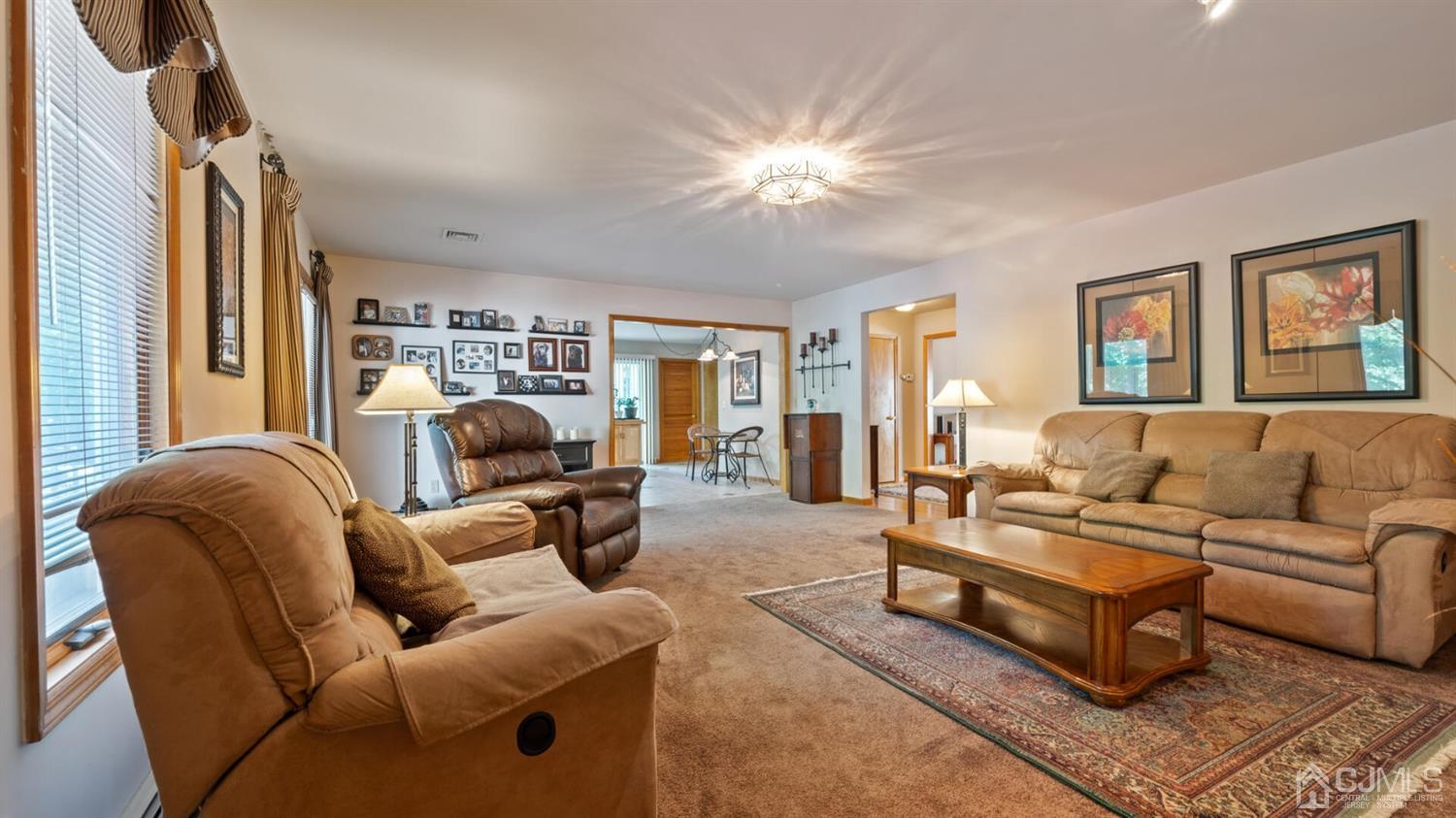 41 Dundee Road Kendall Park, NJ 08824 - Photo 21 of 42 a living room with furniture and a large window