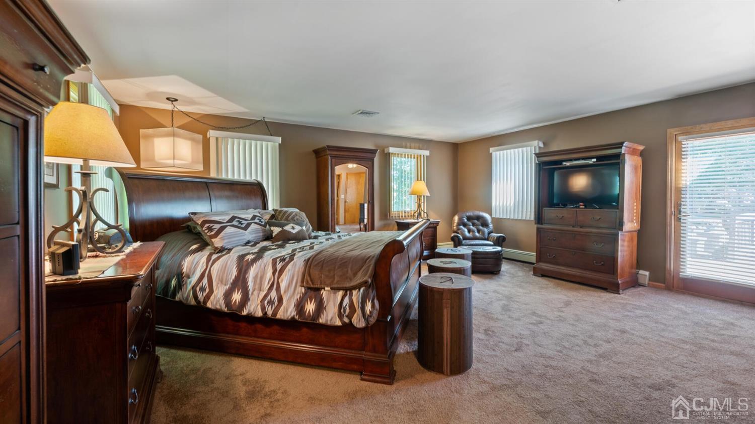 41 Dundee Road Kendall Park, NJ 08824 - Photo 25 of 42 a bed room with a bed and a television