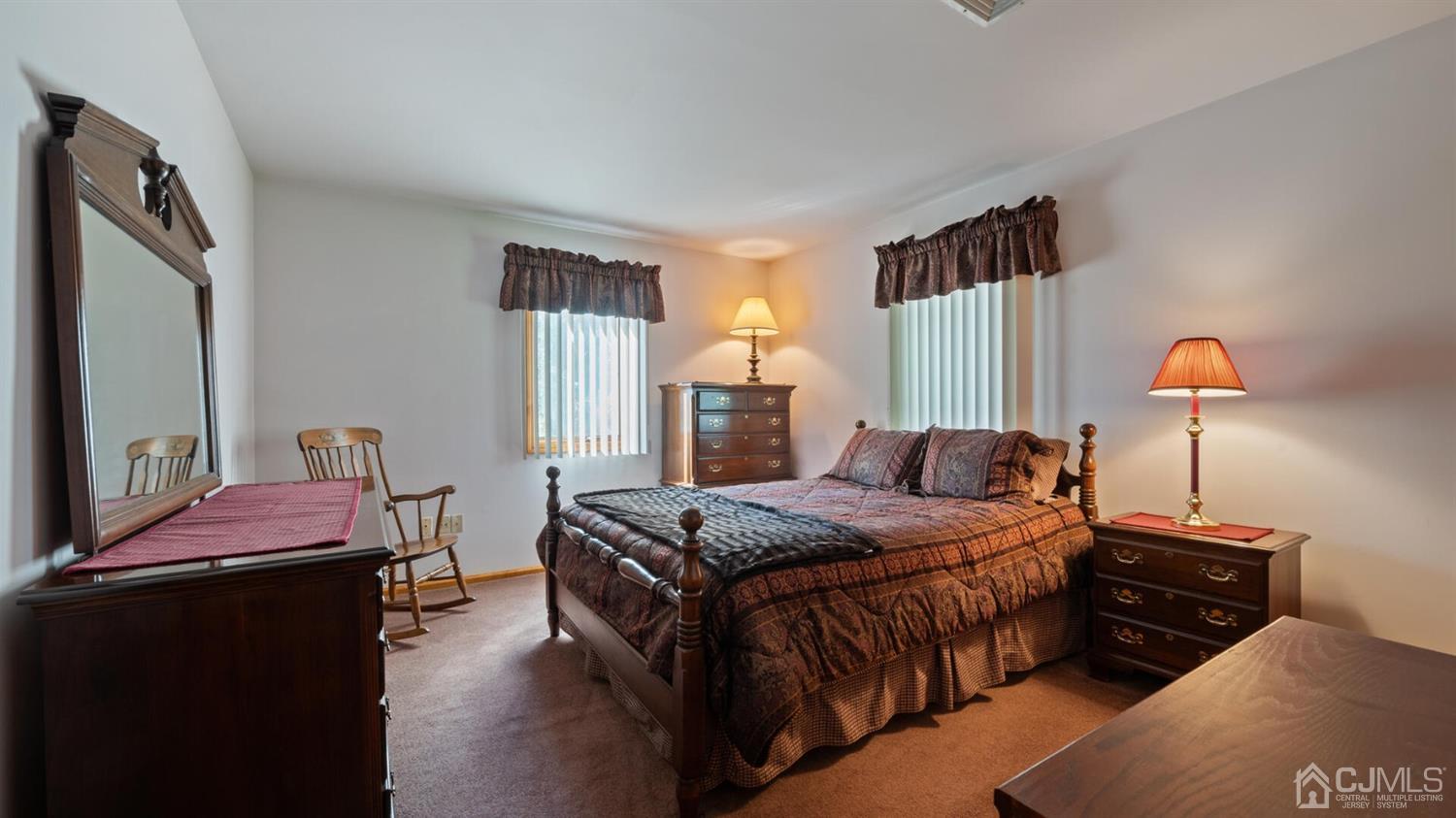 41 Dundee Road Kendall Park, NJ 08824 - Photo 27 of 42 a bedroom with a bed and wooden floor