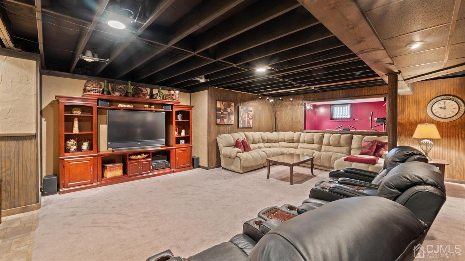 41 Dundee Road Kendall Park, NJ 08824 - Photo 33 of 42 a living room with furniture and a flat screen tv
