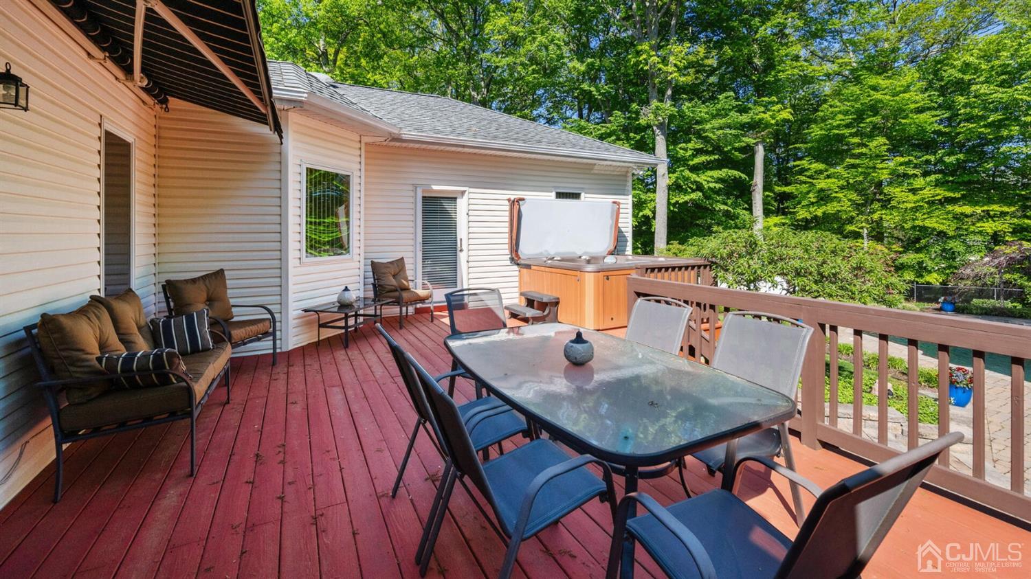 41 Dundee Road Kendall Park, NJ 08824 - Photo 38 of 42 a balcony of a house with wooden floor outdoor seating and yard in the back