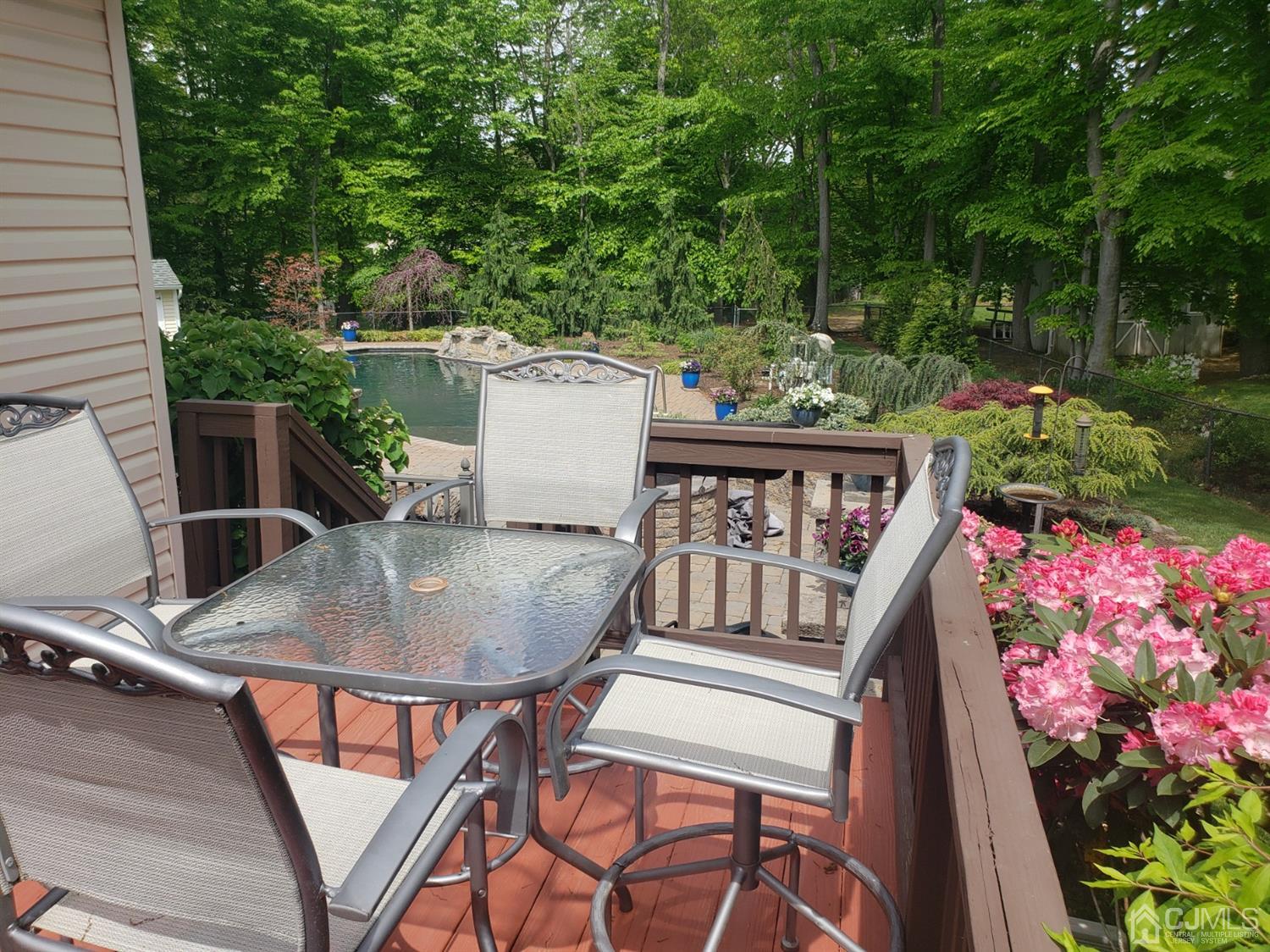 41 Dundee Road Kendall Park, NJ 08824 - Photo 5 of 42 a balcony with wooden floor table and chairs