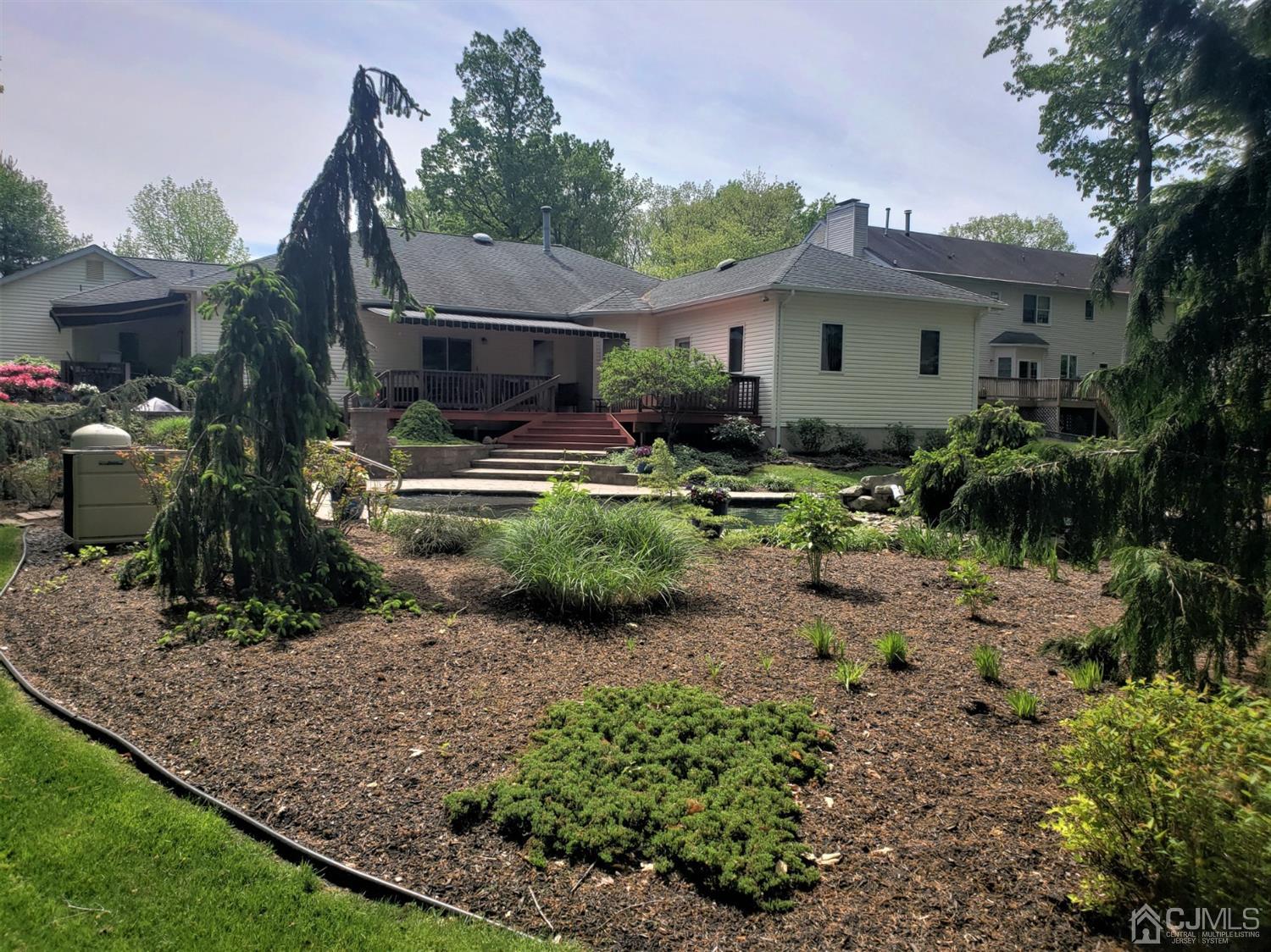 41 Dundee Road Kendall Park, NJ 08824 - Photo 42 of 42 a front view of house with yard and outdoor seating
