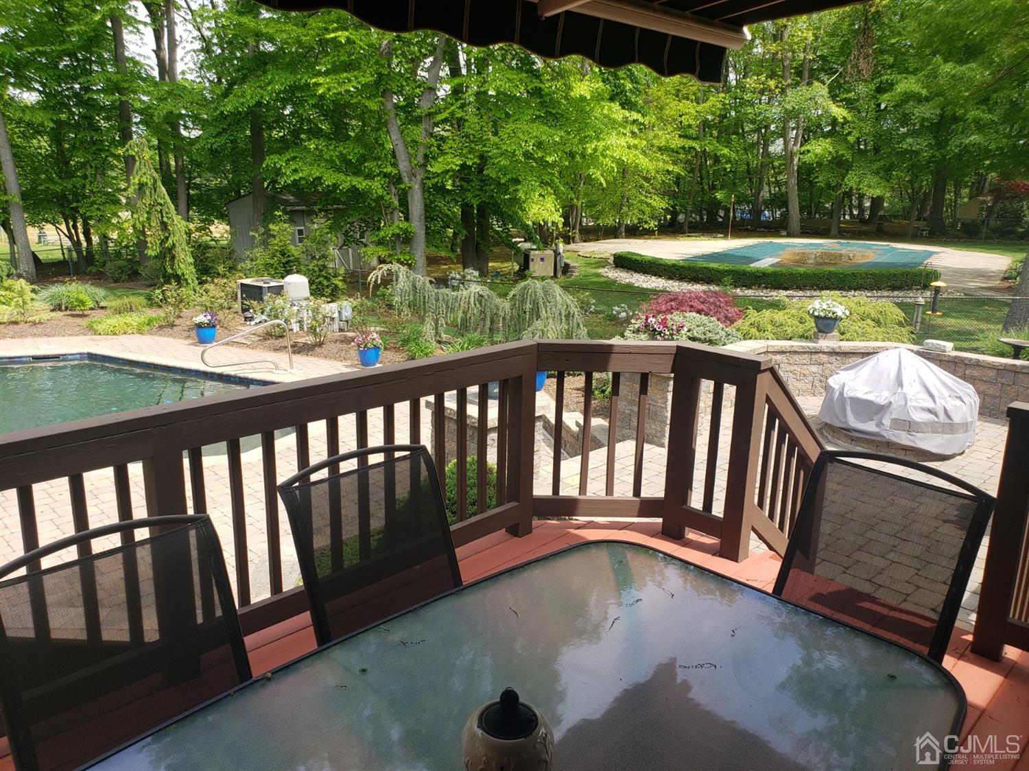 41 Dundee Road Kendall Park, NJ 08824 - Photo 6 of 42 a view of balcony with wooden floor and fence