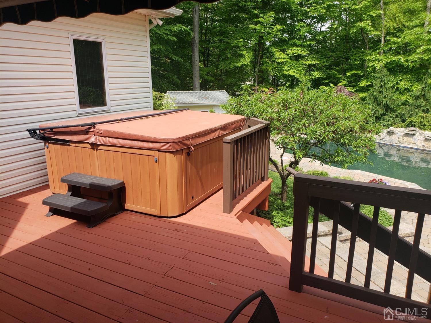 41 Dundee Road Kendall Park, NJ 08824 - Photo 7 of 42 a view of a roof deck with wooden floor and fence