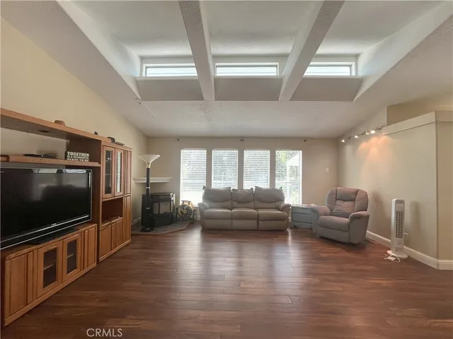 a view of livingroom with furniture wooden floor and windows