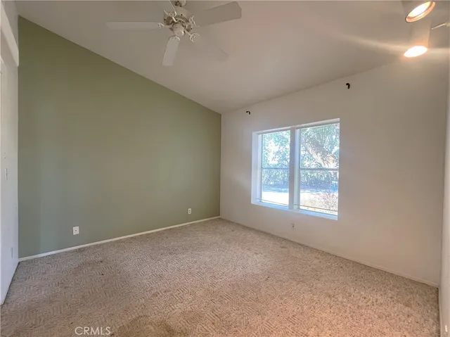 a bathroom with a granite countertop toilet sink and shower
