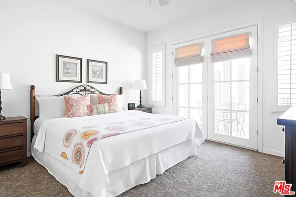 a bedroom with bed and a window