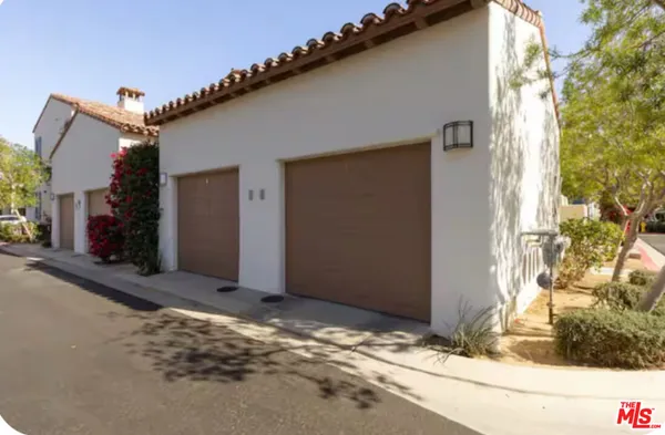a view of a house with a tree