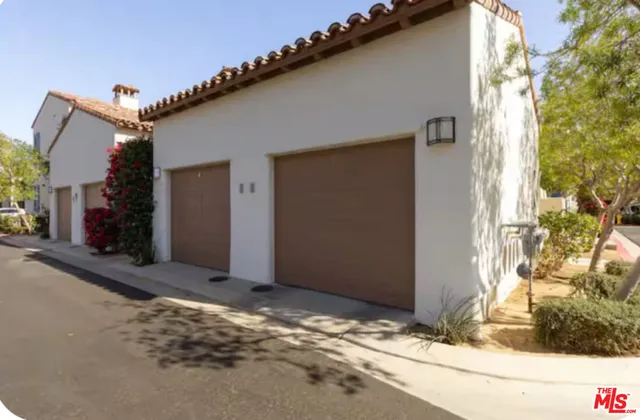 a view of a house with a tree