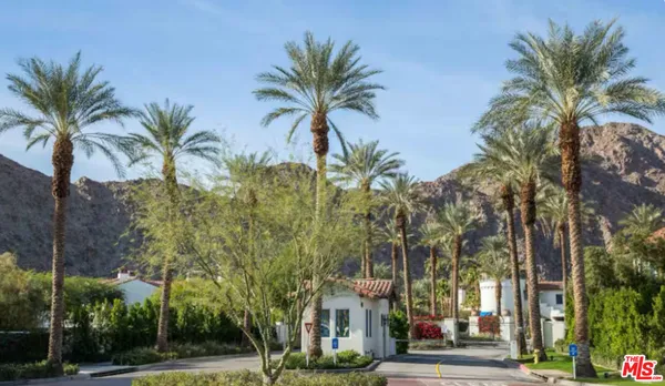 a view of a palm trees in front of a building