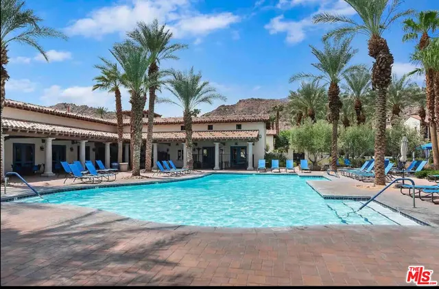 a front view of house with yard and outdoor seating