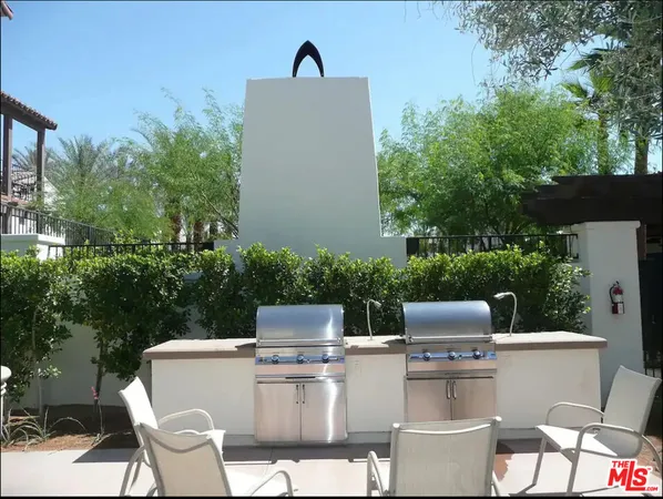 a view of backyard of house with outdoor seating