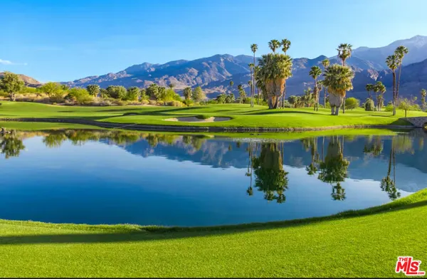 a view of a golf course with a lake