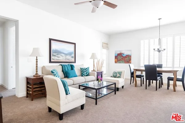 a living room with furniture and a window