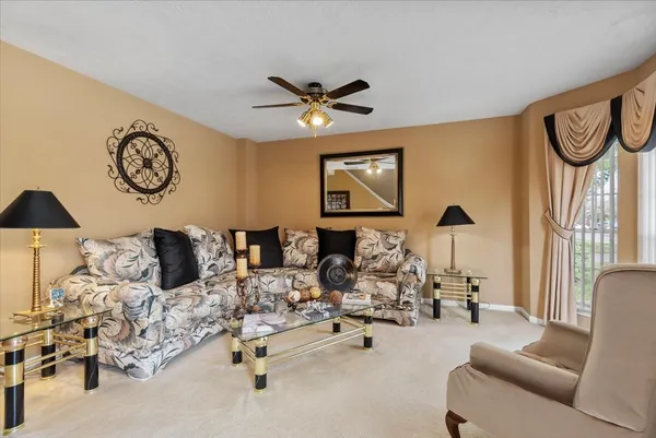 a view of a livingroom with furniture and a chandelier