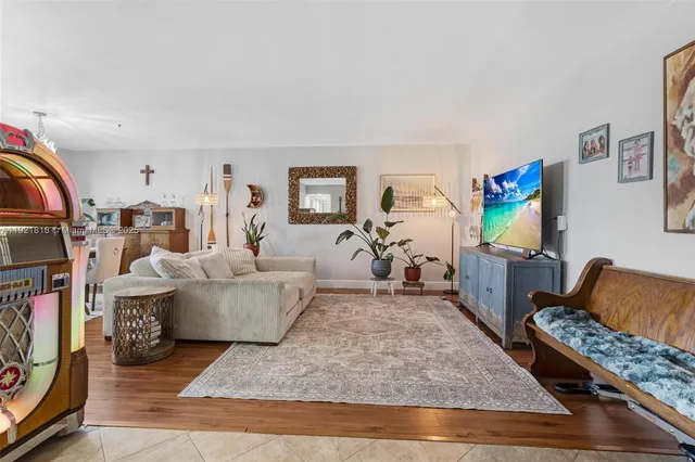 a living room with furniture and flat screen tv