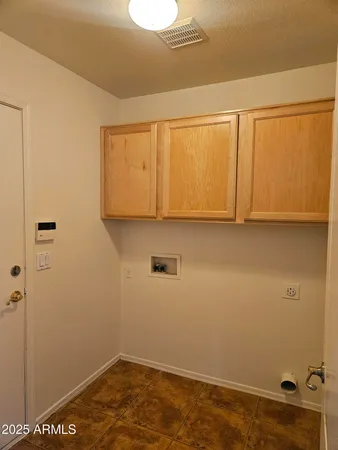 a view of room with cabinets