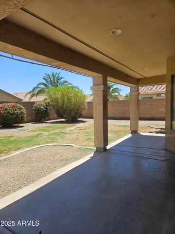 a view of an empty room with a floor to ceiling window