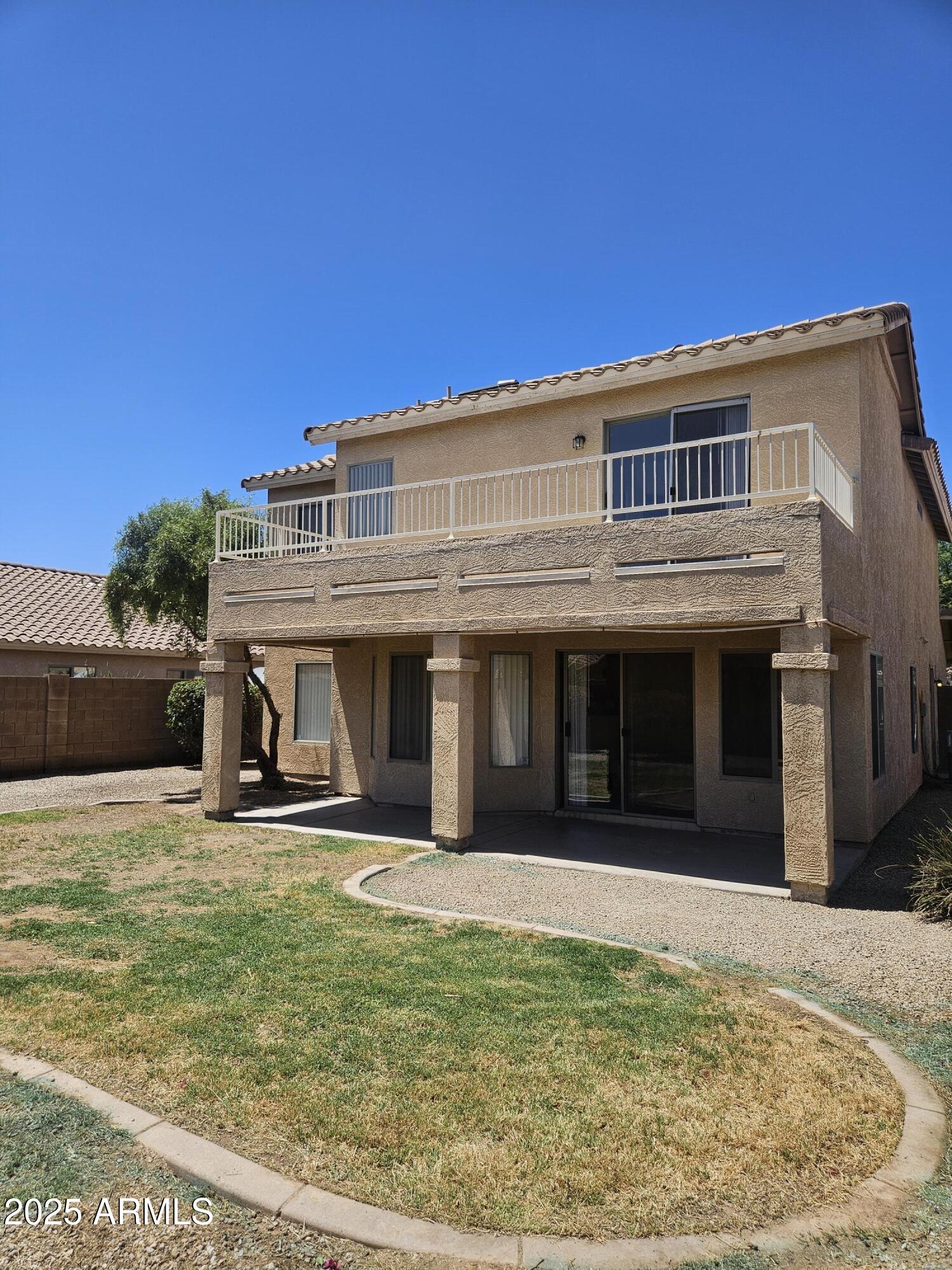 3843 East Derringer Way Gilbert, AZ 85297 - Photo 13 of 13 a view of a house with backyard porch and sitting area