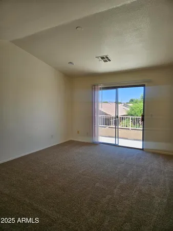 an empty room with an outdoor view and a window