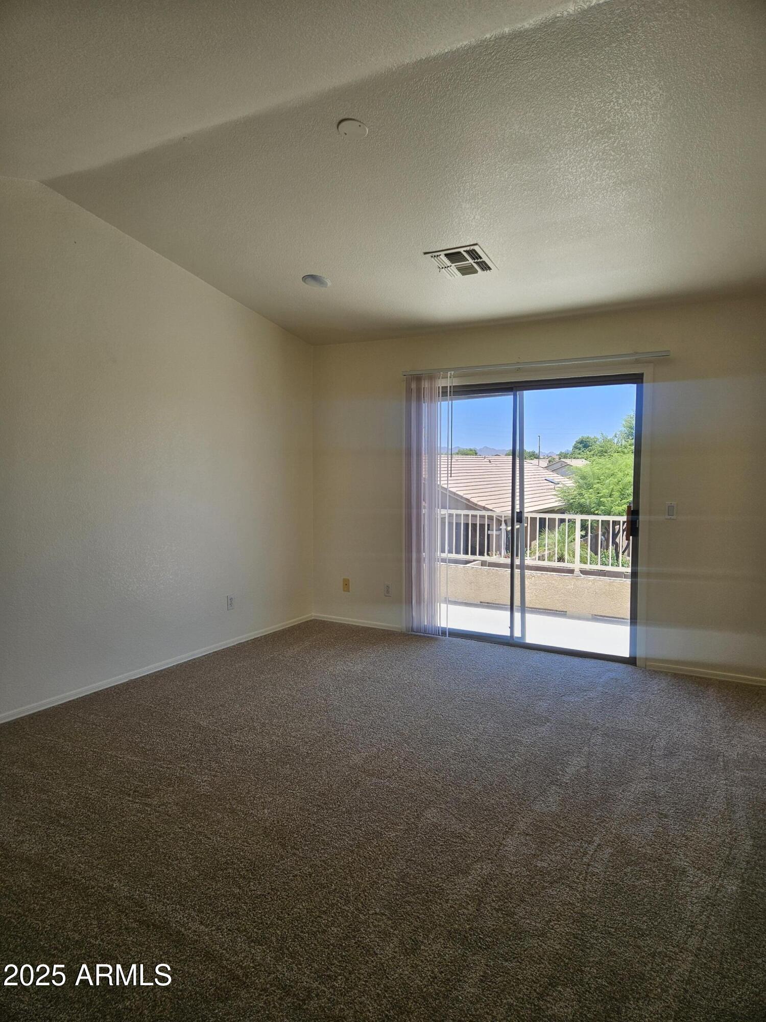 3843 East Derringer Way Gilbert, AZ 85297 - Photo 5 of 13 an empty room with an outdoor view and a window