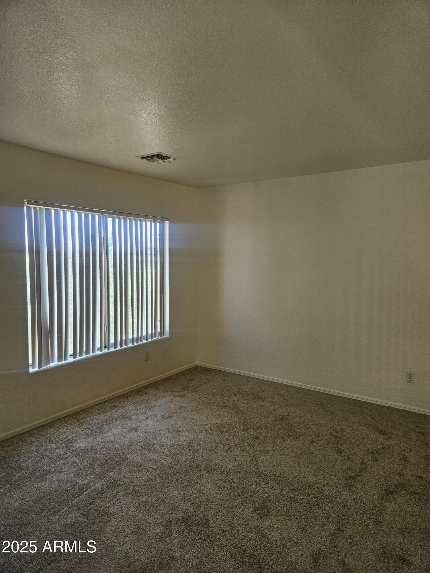 3843 East Derringer Way Gilbert, AZ 85297 - Photo 9 of 13 a view of an empty room with a window