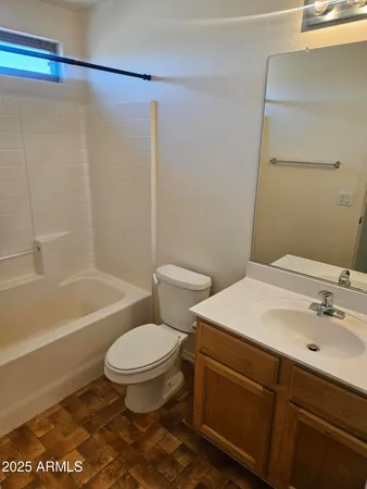 a bathroom with a sink a toilet and a bathtub