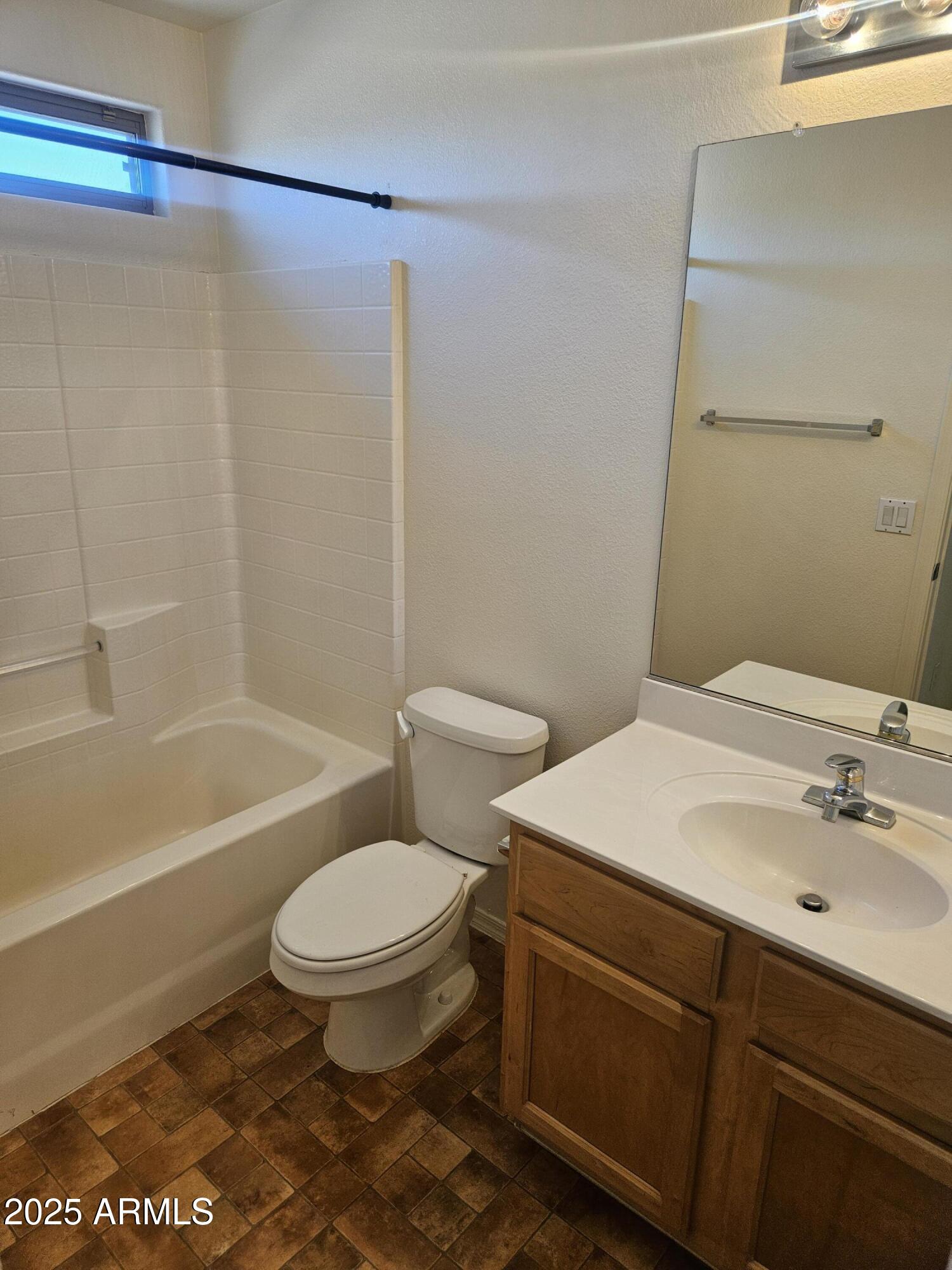 3843 East Derringer Way Gilbert, AZ 85297 - Photo 10 of 13 a bathroom with a sink a toilet and a bathtub