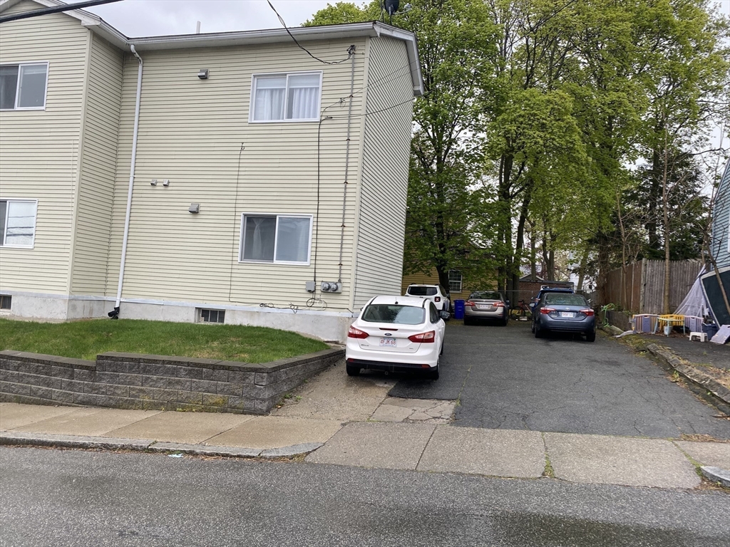 133 Walnut Street, Unit 2 Malden, MA 02148 - Photo 10 of 10 a couple of cars parked in front of a house