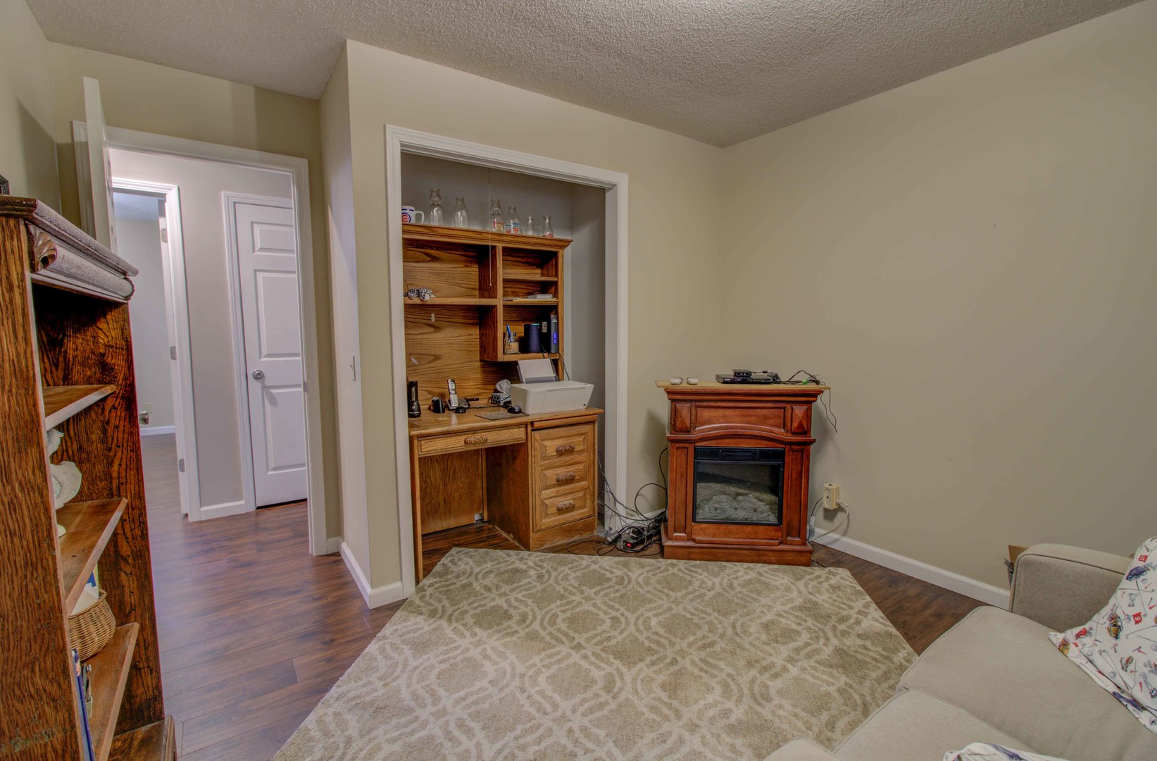 217 Eldorado Drive Tuscola, IL 61953 - Photo 21 of 26 a bedroom with furniture and a fireplace