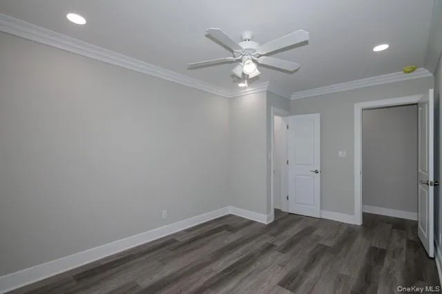 a bathroom with a granite countertop sink a toilet and a mirror
