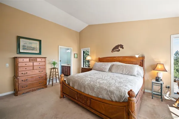 a bedroom with a bed and furniture