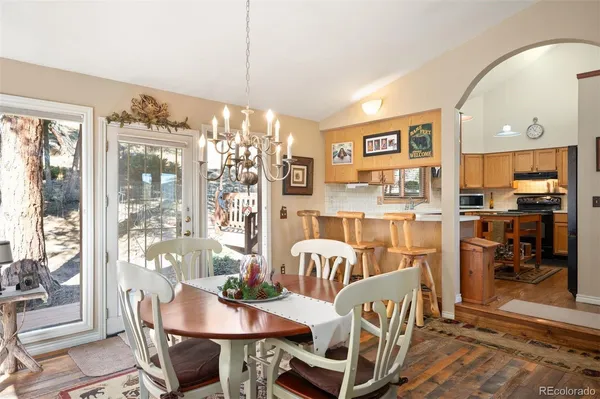 a view of a dining room with furniture window and outside view