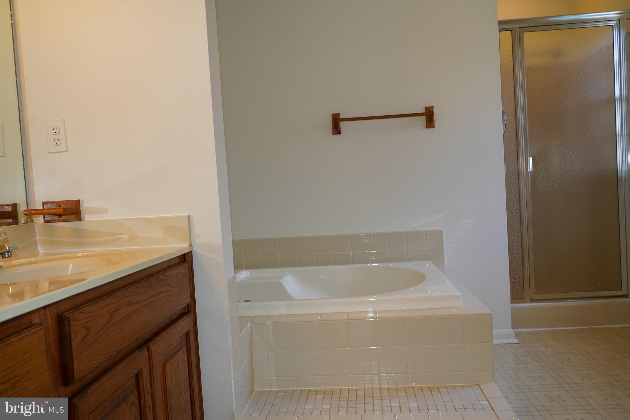 7323 O'Keefe Road Bealeton, VA 22712 - Photo 23 of 48 Serene bathroom with elegant fixtures.