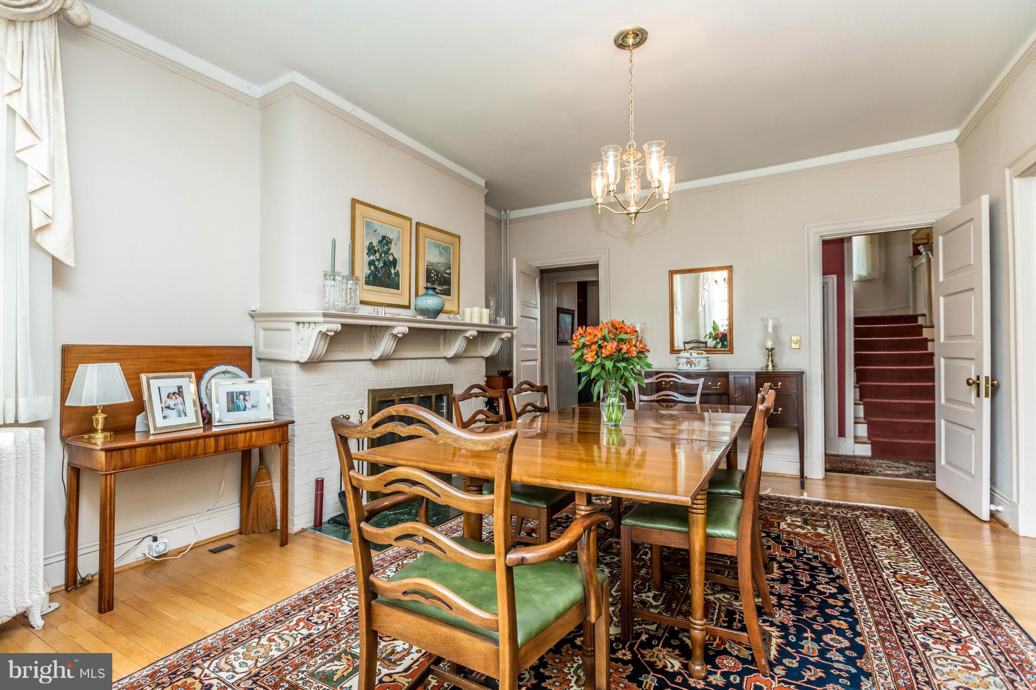 6 Beechdale Road Baltimore, MD 21210 - Photo 9 of 30 a dining room with furniture a rug and a chandelier