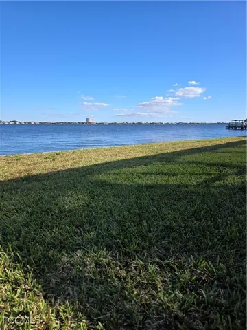 a view of an ocean and a yard