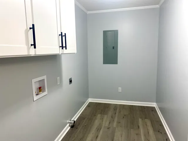 a view of room with window and wooden floor