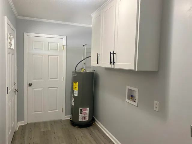 a view of cabinets and wooden floor