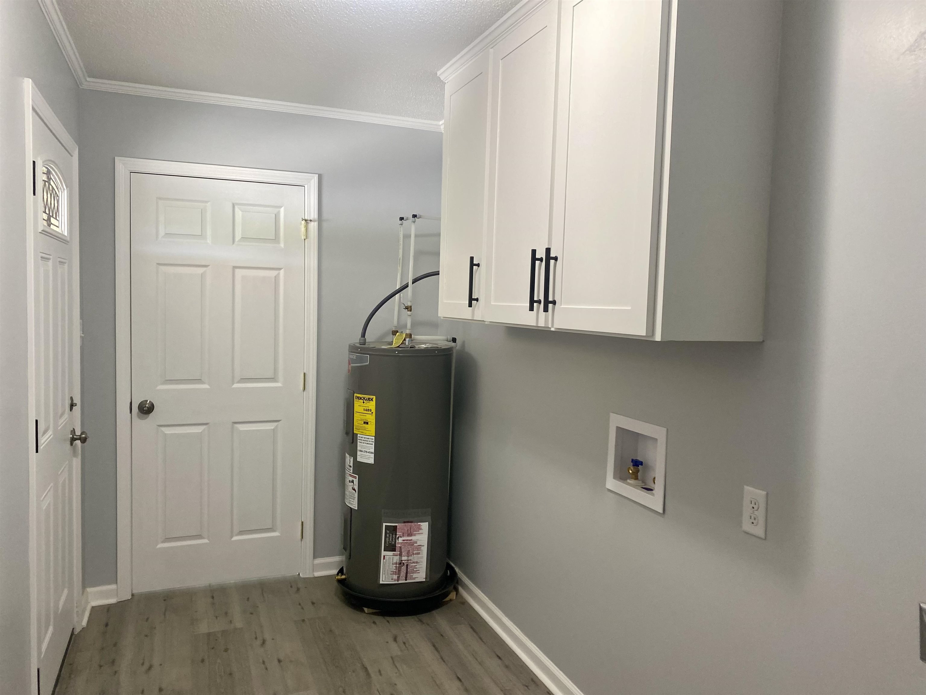 1608 Sam Burlison Road Burlison, TN 38015 - Photo 17 of 25 a view of cabinets and wooden floor