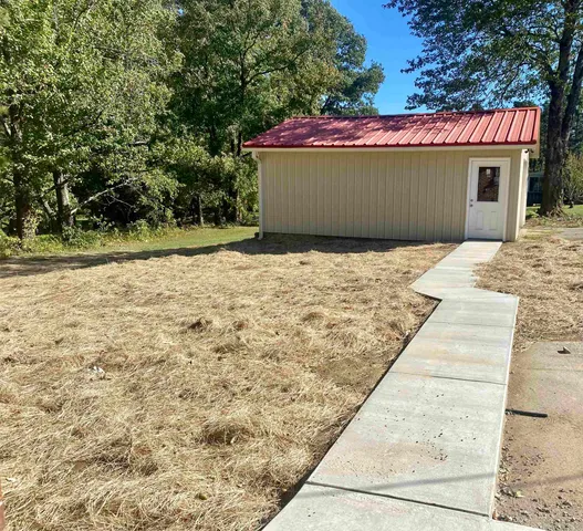 a house with trees in front of it